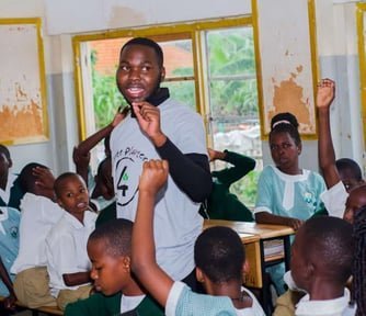 A facilitator leading a school climate club session