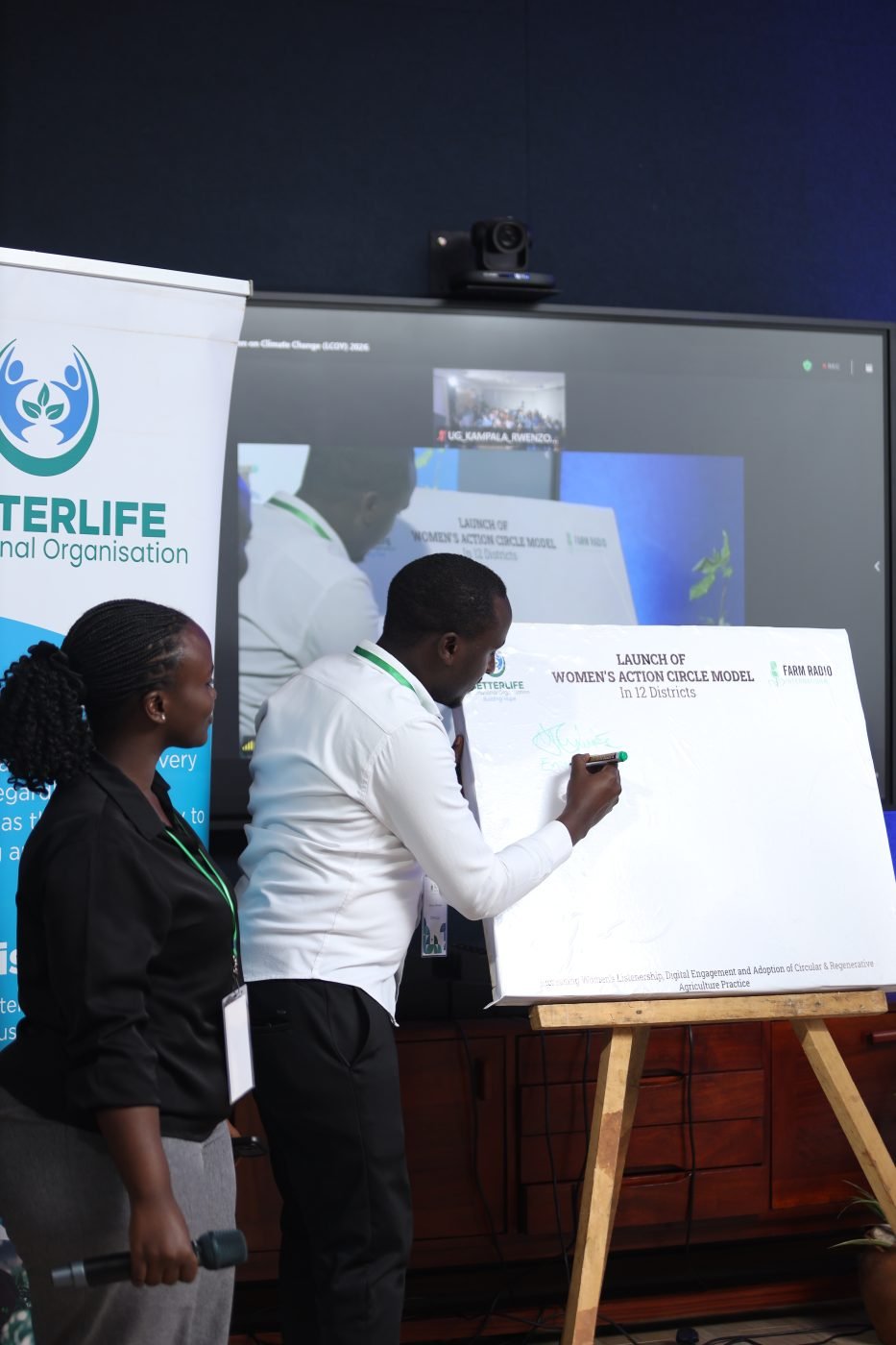 Signing the launch board for the Women’s Action Circle model at LCOY Uganda 2026