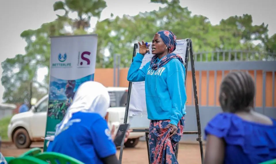 A woman leading a training session at a flipchart