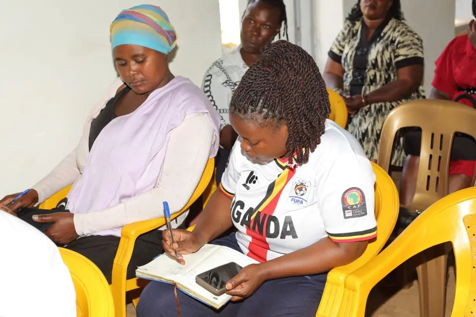 Taking notes at a Women’s Action Circle session in Mukono