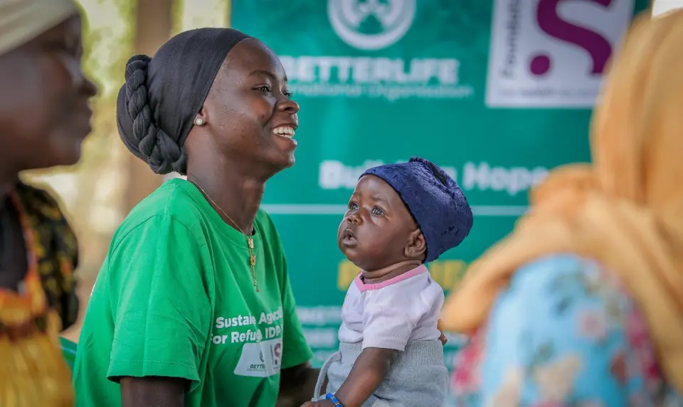 A mother and her baby at a programme session in Yumbe