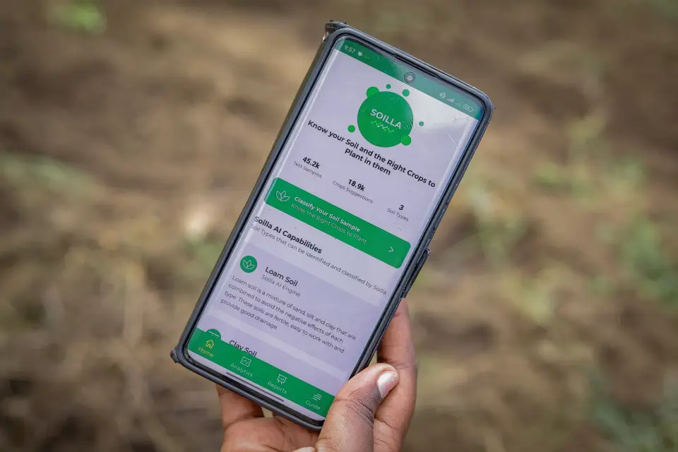 The Soilla app open on a phone in a field